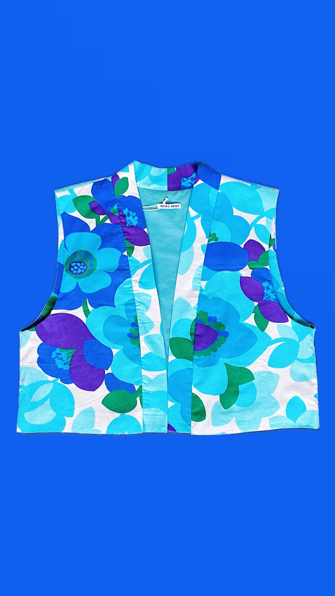 Veste sans manches - fleurs bleues